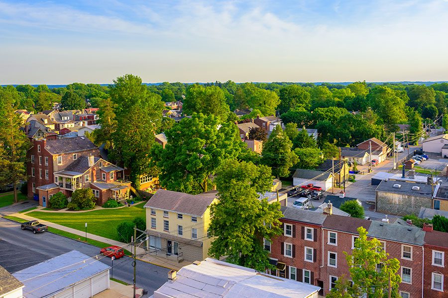 Levittown, PA - Aerial View of Suburban Houses and Sunset Sky